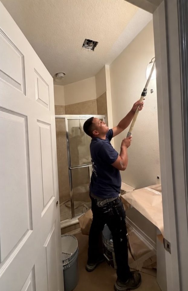 Bathroom repainted from beige to soft blue — before