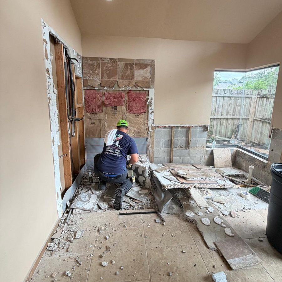 Hamlet removing old shower tile and backer board during a bathroom demolition