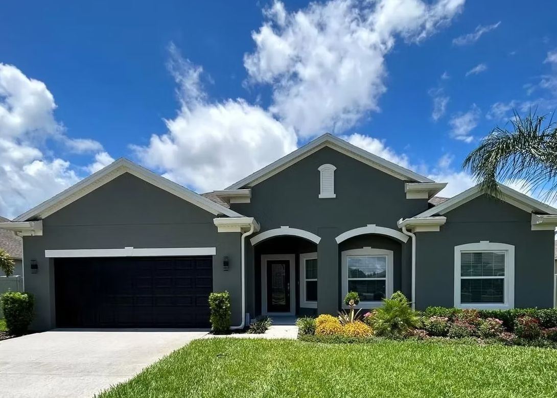 Gray exterior house painting project in Central Florida