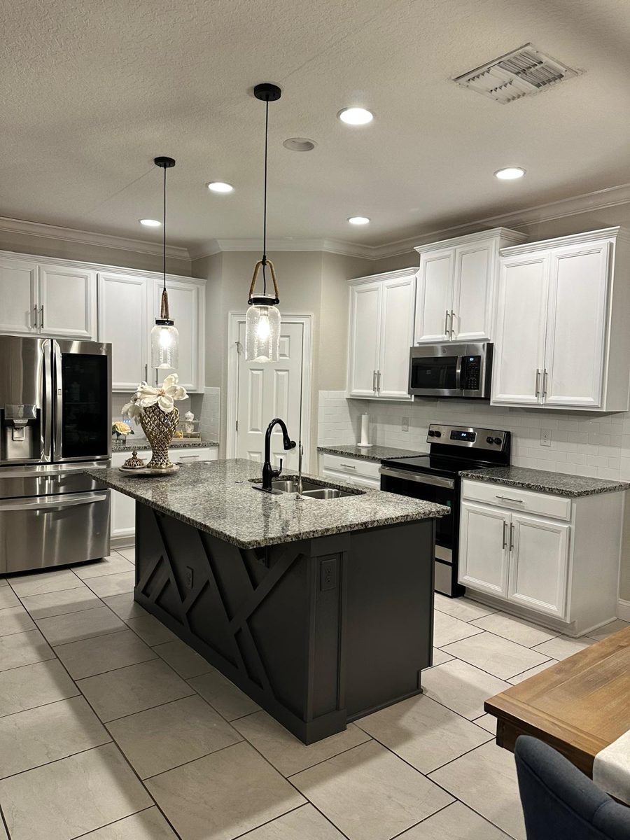 Kitchen cabinets painted from dark espresso to white with a charcoal island — after